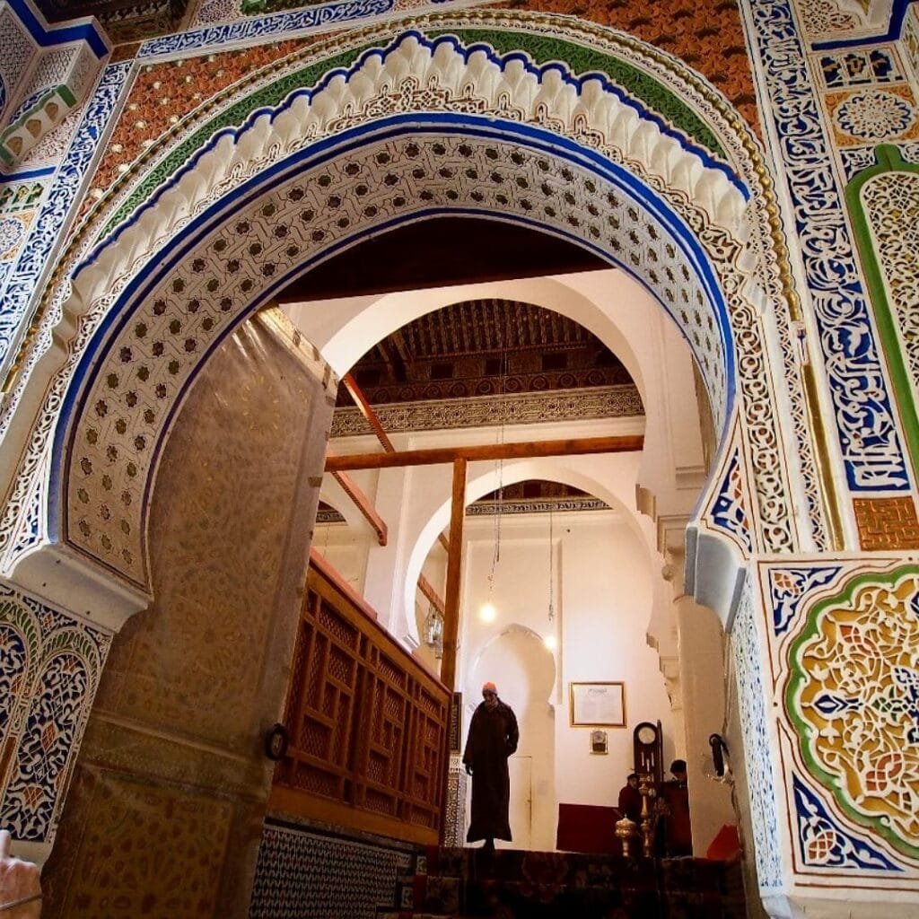 Top Things That Make Fez Special: History & Handicrafts 10 The Mausoleum of Moulay Idriss is one of the most revered sites in Fes, Morocco. As the final resting place of Moulay Idriss II, the city's founder and a key figure in Moroccan history, it stands as a symbol of spirituality and heritage. Located in the heart of the medina, the mausoleum is distinguished by its ornate green-tiled roof, intricate zellige tilework, and majestic wooden doors. Although non-Muslims cannot enter, visitors can admire its stunning exterior and experience the serene atmosphere of this historical and religious landmark.