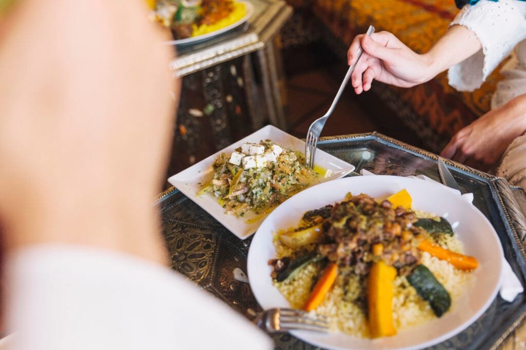 5 Authentic Local Experiences We Recommend Trying in Morocco (Away from the Typical Tourist Spots) 7 Do you dream of replicating the rich, aromatic flavors of a perfectly slow-cooked Tagine in your own kitchen? Or perhaps the delicate, fluffy grains of Couscous, so central to Moroccan family meals? Or even the exquisite sweet and savory layers of a Pastilla, a true culinary masterpiece?Imagine turning that dream into a delicious reality! This isn't just a cooking demonstration; it's an immersive dive into the heart of Moroccan home cooking. You'll step directly into a warm, traditional Moroccan kitchen, often nestled within a charming riad or a family home in the labyrinthine medina. Here, you'll be welcomed by a hospitable Moroccan host, typically a mother or grandmother, who will become your culinary guide.