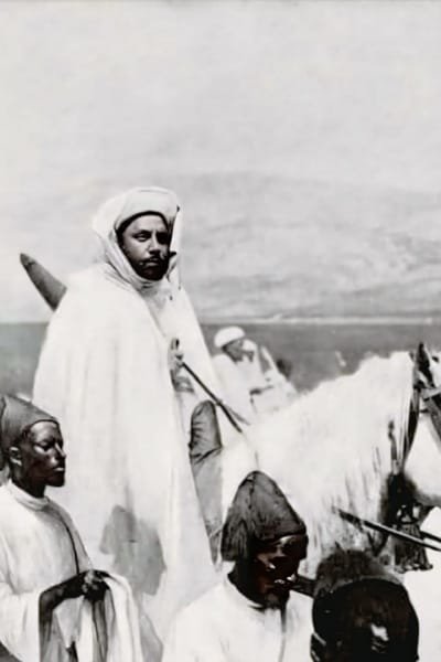 A historical image of Sultan Moulay Abdelhafid on a white horse, surrounded by royal guards. The scene symbolizes the turning point in Moroccan history with the 1912 Treaty of Protection with France.