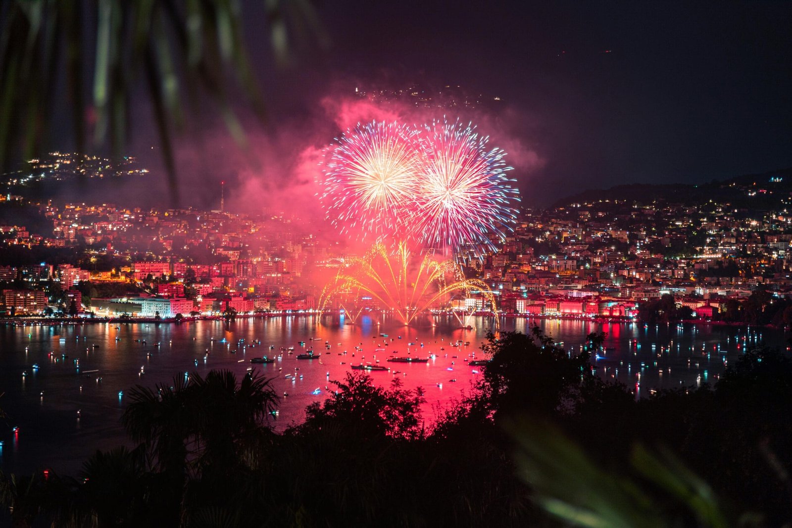 Tourist Transport 11 Stunning fireworks light up the night sky over Lake Lugano, Switzerland. A celebration of color and light.
