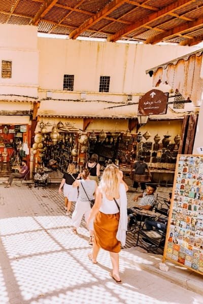 A stunning view of the intricate blue mosaic exterior of Bab Boujloud (The Blue Gate) in Fez. This iconic landmark acts as the grand entrance to the old Medina, symbolizing the city's rich history and vibrant life.