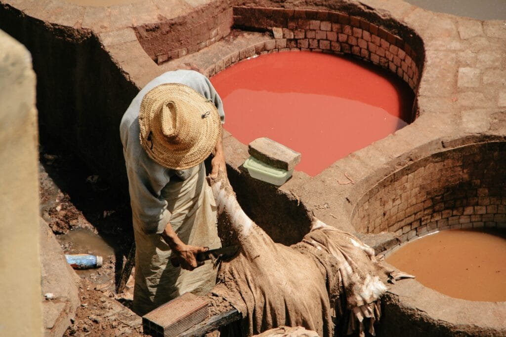 Top Things That Make Fez Special: History & Handicrafts 21 No visit to Fez would be complete without experiencing the vibrant and iconic Chouara Tannery.
Dating back to the 11th century, this tannery is one of the oldest and largest in the world.
Here, you can witness artisans practicing ancient techniques of leather-making, using natural dyes and traditional methods that have barely changed in centuries.
From the rooftops overlooking the tannery, you’ll be treated to a colorful and unforgettable view of the dyeing vats,