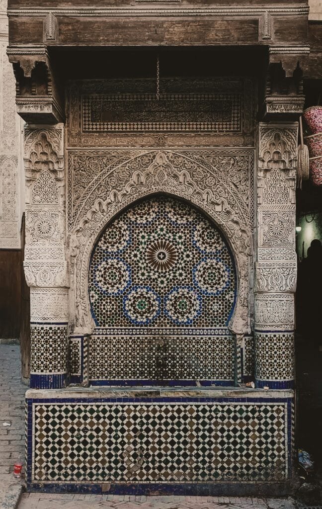 Located in the heart of Fez’s ancient medina, Nejjarine Square is one of the city's most charming and historic plazas. Named after the “Nejjarine” (woodworkers) who have practiced their craft here for centuries, the square remains alive with the spirit of traditional Moroccan artisanship. 🏛️ Highlights of the Square: Nejjarine Museum of Wooden Arts & Crafts: Housed in a beautifully restored 18th-century caravanserai (funduq), the museum showcases an impressive collection of wooden tools, carved doors, furniture, and artistic pieces that celebrate Morocco’s woodworking heritage. Nejjarine Fountain: One of the most stunning public fountains in Fez, adorned with colorful zellige tiles and carved wood — once a vital stop for travelers and traders to refresh. 🌍 Why Visit? Surrounded by traditional shops selling handcrafted furniture, wooden decor, and artisanal treasures. A perfect blend of living craftsmanship and historic beauty. Centrally located, it’s a must-see stop on any medina tour, close to major landmarks like the Al-Qarawiyyin Mosque and Attarine Souk. Visiting Nejjarine Square is a journey into the timeless artistry and cultural soul of Fez, where history and handmade beauty come to life.