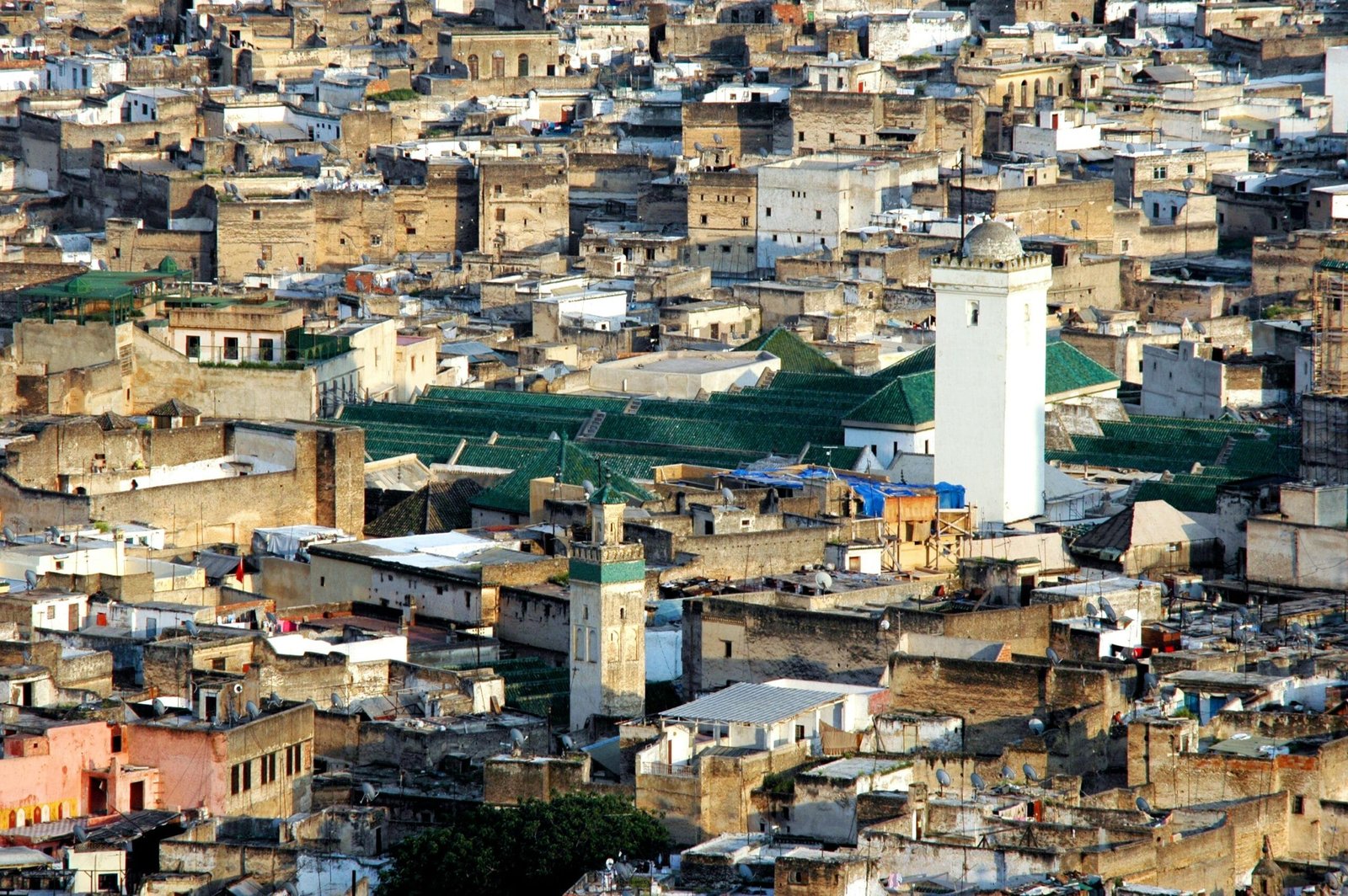 Top Things That Make Fez Special: History & Handicrafts 4 Fez blends stunning traditional architecture with modern urban scenes, creating a unique juxtaposition of old-world charm and vibrant city life."