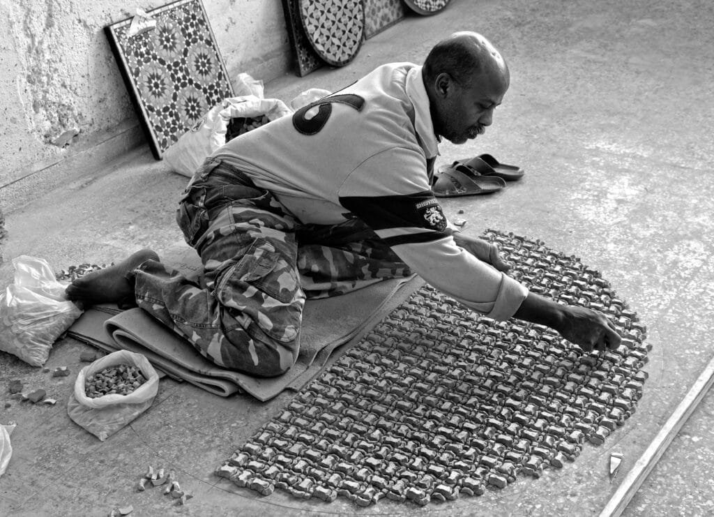 Why Is Fez, Morocco, Famous? 15 Zellige is one of Morocco’s most breathtaking traditional arts, and in Fez, you’ll find some of the most talented artisans in the country still practicing this intricate craft by hand. These master craftsmen cut and shape small pieces of glazed tile — each one with mathematical precision — to form mesmerizing geometric patterns that decorate mosques, madrasas, palaces, fountains, and homes. Working with only basic tools, the process demands patience, deep concentration, and artistic vision. Every design is assembled like a puzzle, with hundreds or even thousands of hand-cut tiles fitting together seamlessly. 🔷 What Makes Zellige Special: Each piece is handmade — no machines, just pure skill and tradition. It reflects the spiritual and mathematical beauty of Islamic art. The craft is passed down through generations, keeping Moroccan heritage alive tile by tile. When you see a zellige panel, you’re not just looking at decoration — you're witnessing the result of hours of dedication and centuries of knowledge.