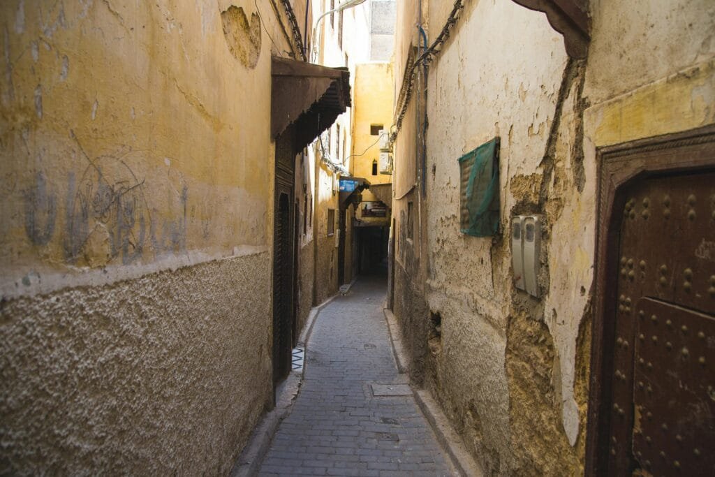 The narrow streets of Fez are peaceful and quiet in the early morning, offering visitors a tranquil opportunity to explore the ancient city before it gets busy."

