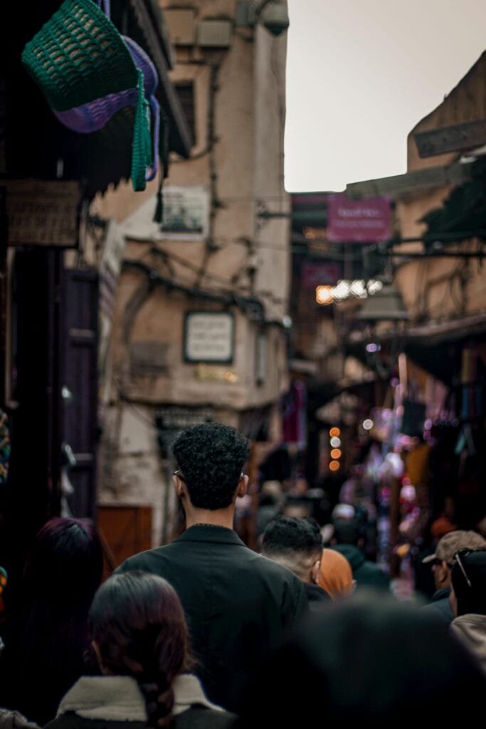 Fez Shopping Guide: What to Buy in Morocco’s Craft Capital 22 Fez's bustling markets come alive during peak hours, where locals and tourists mingle, creating a lively shopping experience in the heart of the city."