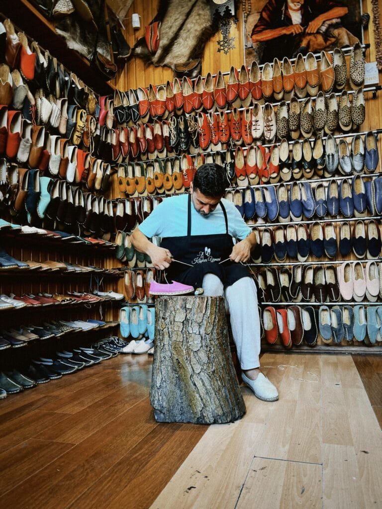 Top Things That Make Fez Special: History & Handicrafts 105
In the heart of Fez, the Khraz (leather shoemakers) are the artisans behind some of Morocco’s most iconic and elegantly crafted traditional footwear. These skilled craftsmen specialize in creating custom leather shoes such as the famous Boulgh (a traditional Moroccan slipper) and Cherbil (a type of pointed leather shoe).Using high-quality leather, these artisans meticulously design and craft shoes that are comfortable, durable, and reflect the timeless Moroccan aesthetic. The leather is dyed and worked by hand, ensuring each piece is unique and of exceptional quality.👡 What You’ll Find:
Boulgh: These soft, pointed slippers are a staple in Moroccan culture. Known for their comfort and stylish appearance, Boulgh are often worn at home, at celebrations, or even as part of traditional attire.Cherbil: A type of leather shoe that is particularly stylish, with a pointed toe and often adorned with unique embroidered details. Cherbils are worn by both men and women and are a symbol of Moroccan elegance.🌟 Why It’s Worth Visiting:
Craftsmanship: The Khraz employ generations-old techniques, ensuring each pair of shoes is handcrafted with care and precision.Cultural Significance: These shoes are more than just footwear; they are an important part of Moroccan culture, often seen in traditional ceremonies and daily life.Authenticity: If you want to take home an authentic Moroccan souvenir, nothing beats a pair of handmade leather shoes that reflect the heart and soul of Fez.Tip for visitors: Visit Qasariya al-Kifah (Ciseria al-Kifah), where you can find these artisans working in their shops. It's a perfect place to purchase a pair of Boulgh or Cherbil and enjoy the authentic Moroccan shopping experience.