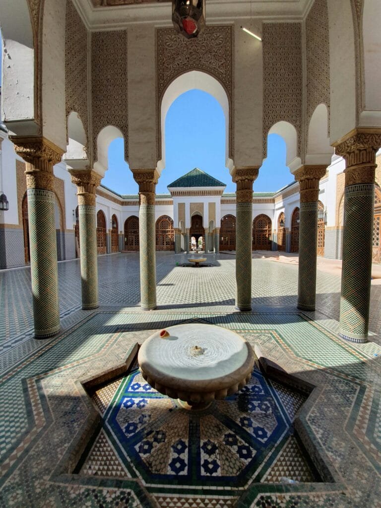 Top Things That Make Fez Special: History & Handicrafts 33 Located in the heart of Fes el-Bali, along the banks of the Fez River, the Al-Andalus Mosque is one of the oldest and most beautiful mosques in Morocco. It was founded around 859 AD by Mariam al-Fihri, the sister of Fatima al-Fihri, who founded the famous Al-Qarawiyyin Mosque. Together, these two sites form a spiritual and historical pair that shaped the identity of the city.🌍 Why Visit?
It represents the Andalusian-Moroccan heritage, telling the story of Muslim refugees from Andalusia who brought their knowledge, culture, and craftsmanship to Fez.The mosque features stunning Islamic architecture: elegant arches, intricate stucco work, and a beautifully carved wooden minbar.While non-Muslims cannot enter the interior, the outer façade, courtyard views, and tranquil surroundings make it well worth the visit.📍 Location:
Situated in the Andalusian Quarter, directly across the river from the Al-Qarawiyyin Mosque, it fits perfectly into any walking tour of the old medina.A visit to Al-Andalus Mosque offers a moment of reflection and a glimpse into the artistic and spiritual depth of Islamic civilization in Fez.