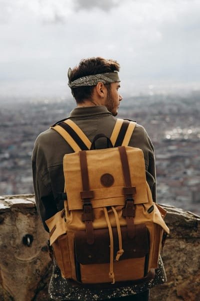 A busy scene of tourists and locals walking through the souks of Jemaa el-Fnaa square in Marrakech, with numerous stalls selling Moroccan products and crafts. This image reflects guided tours and the opportunity to purchase authentic Moroccan goods and souvenirs.