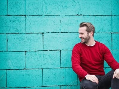 Large group camel trek on the golden dunes of Merzouga, Morocco Sahara Desert.