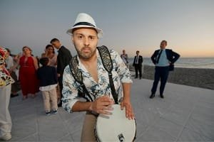 A highly satisfied female tourist smiling happily outdoors, representing the "best guided tour ever" experience with knowledgeable, multilingual Guide Abdul in Fes, Morocco.
