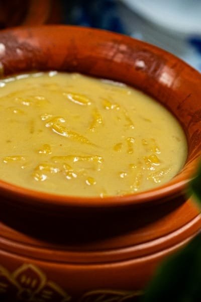 A close-up view of a traditional bowl of Moroccan Bissara (fava bean soup), highlighting the authentic, lesser-known local dishes tasted during the Fes Food Tour.